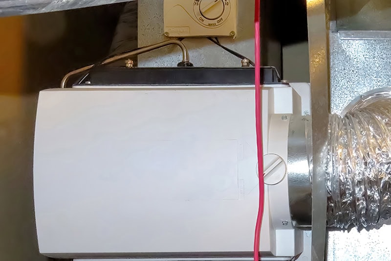 Close up photo of a furnace installed in a basement.