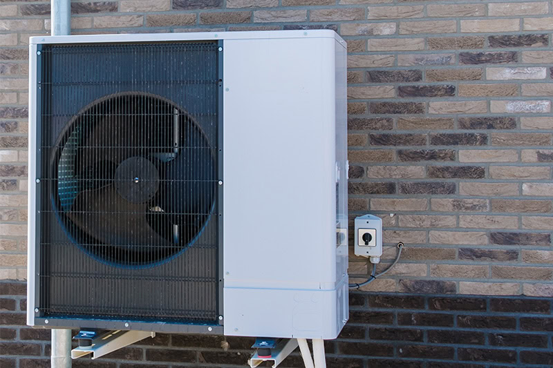Mounted heat pump outside residential home in St. George, Utah.
